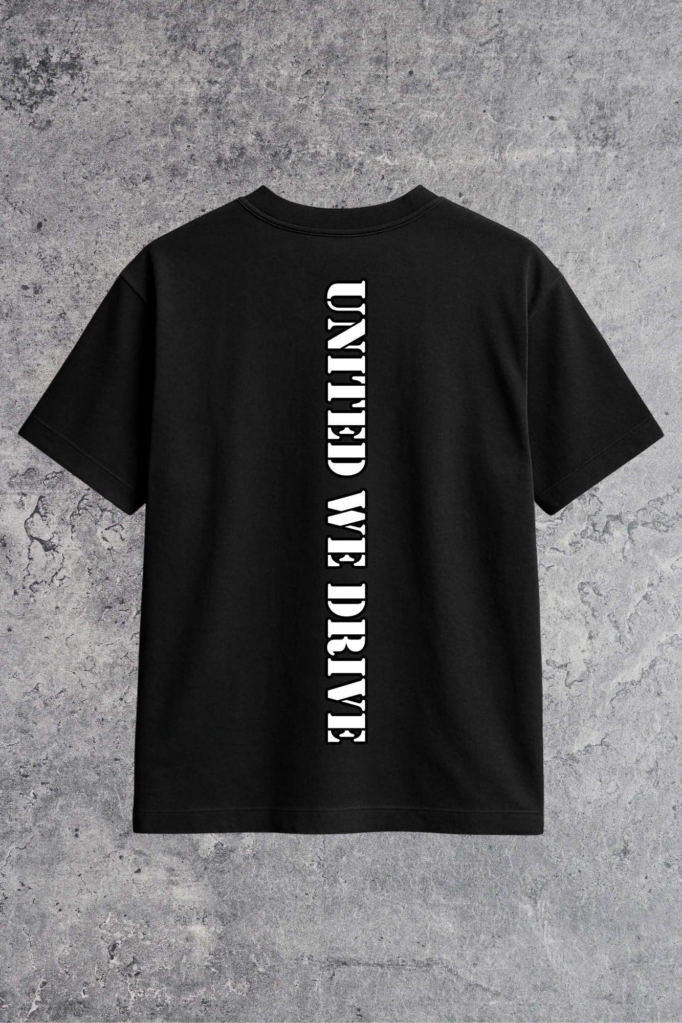 Black t-shirt with 'UNITED WE DRIVE' text on a gray concrete background