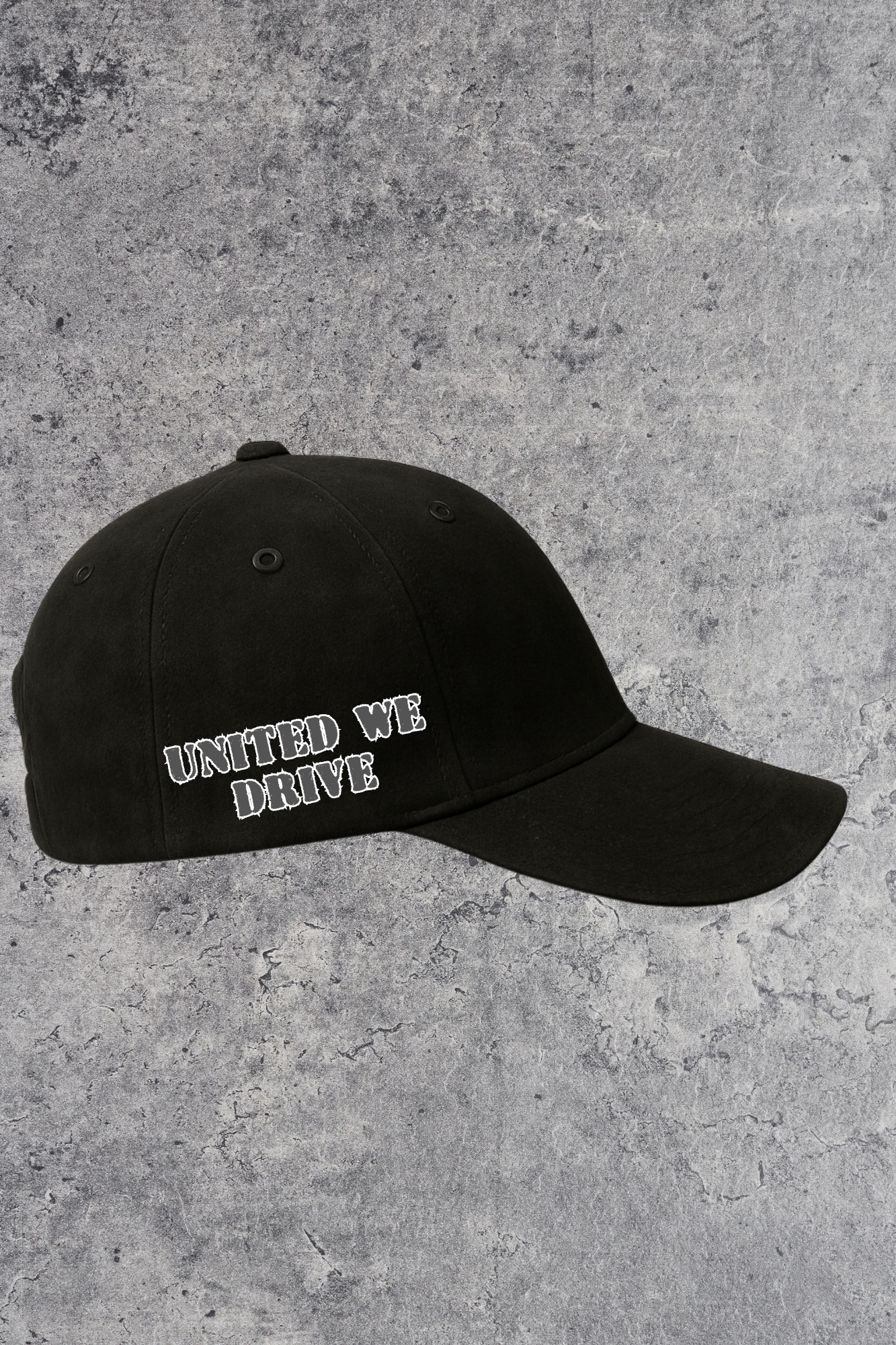 Black cap with 'UNITED WE DRIVE' text on a gray concrete surface